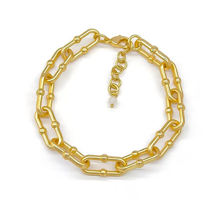 Kultainen paperiliitin rannekoru